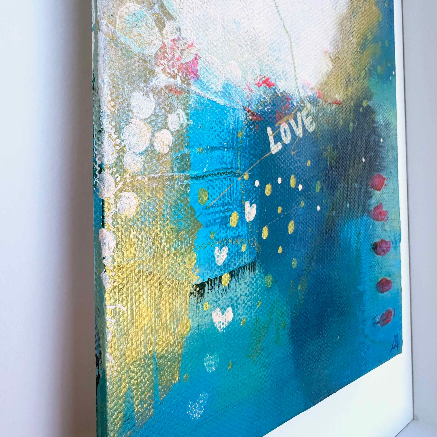 Small abstract original painting inspired by the colours of the ocean in Cornwall. The words Love and Joy can be found within the painting