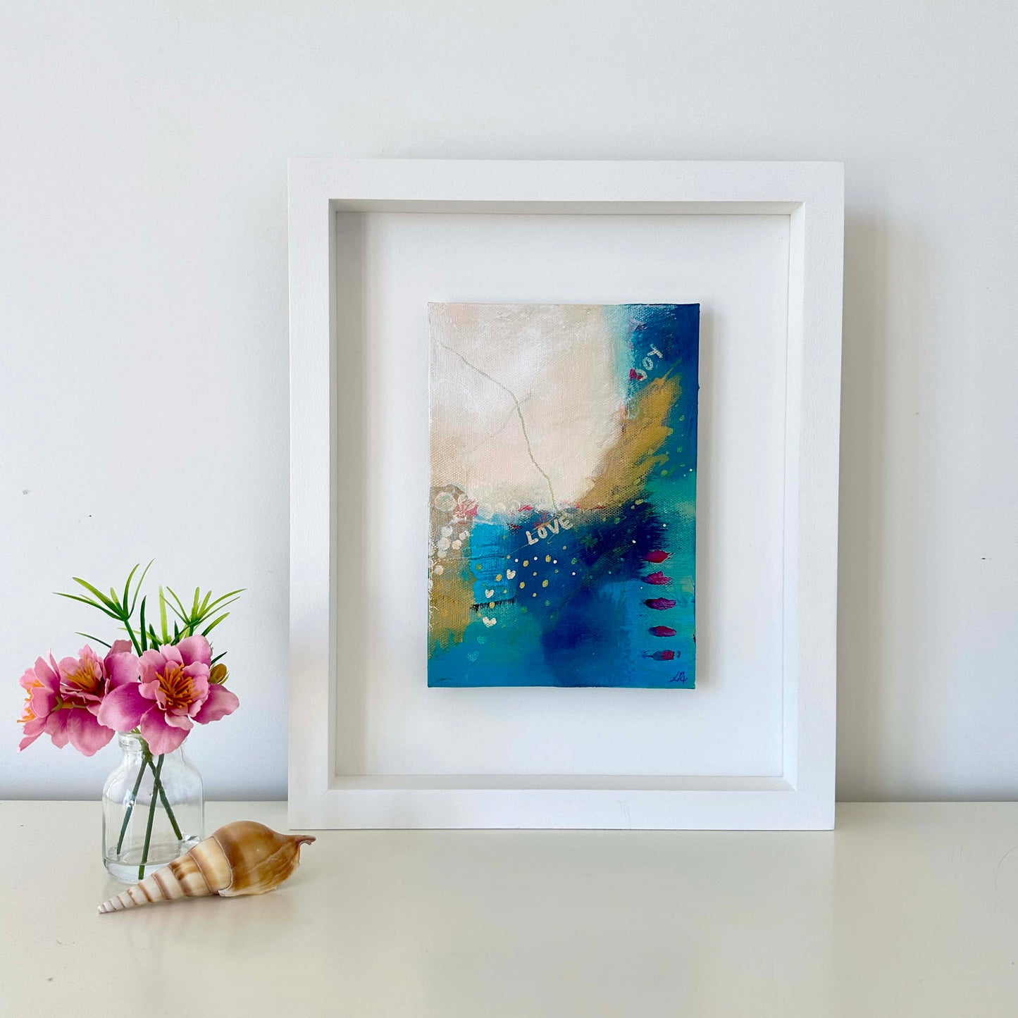 Small abstract original painting inspired by the colours of the ocean in Cornwall. The words Love and Joy can be found within the painting