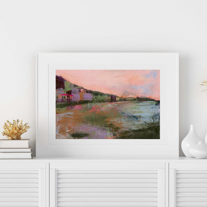 Meet Me Before The Sunsets paper print set in a white frame on a white cabinet