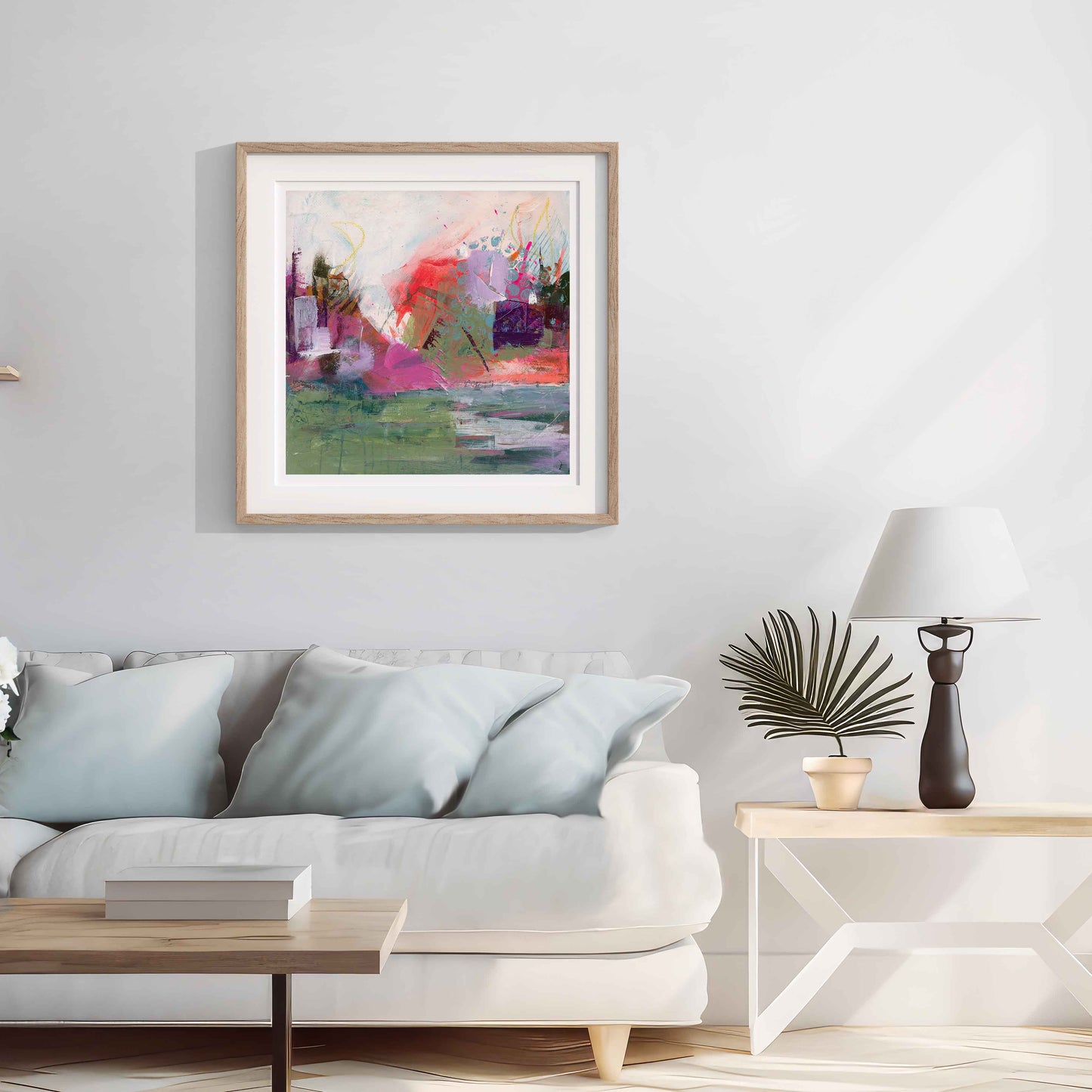 Where The Tide Lifts Abstract art print framed in a wooden frame painting on a wall above a sofa in a living room.