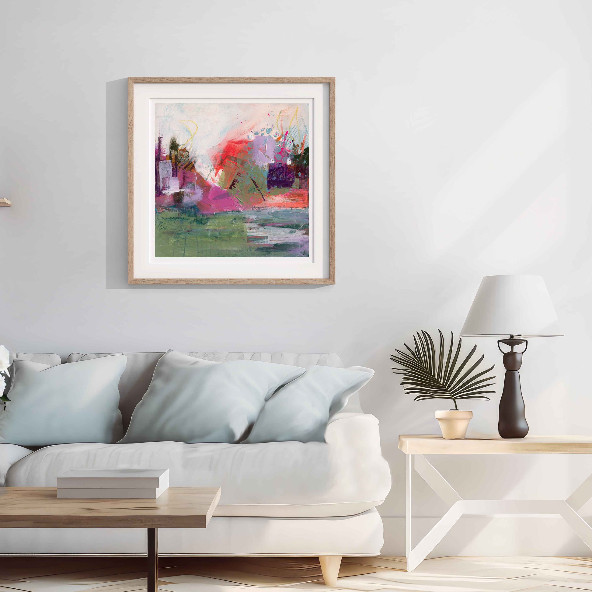 Where The Tide Lifts Abstract art print framed in a wooden frame painting on a wall above a sofa in a living room.
