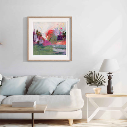 Where The Tide Lifts Abstract art print framed in a wooden frame painting on a wall above a sofa in a living room.