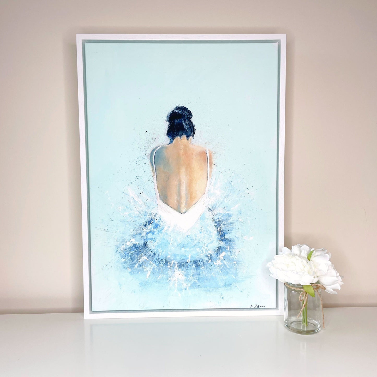 A2 Canvas Print of an acrylic painting of a ballerina painted in blue. Framed in a white wooden frame.